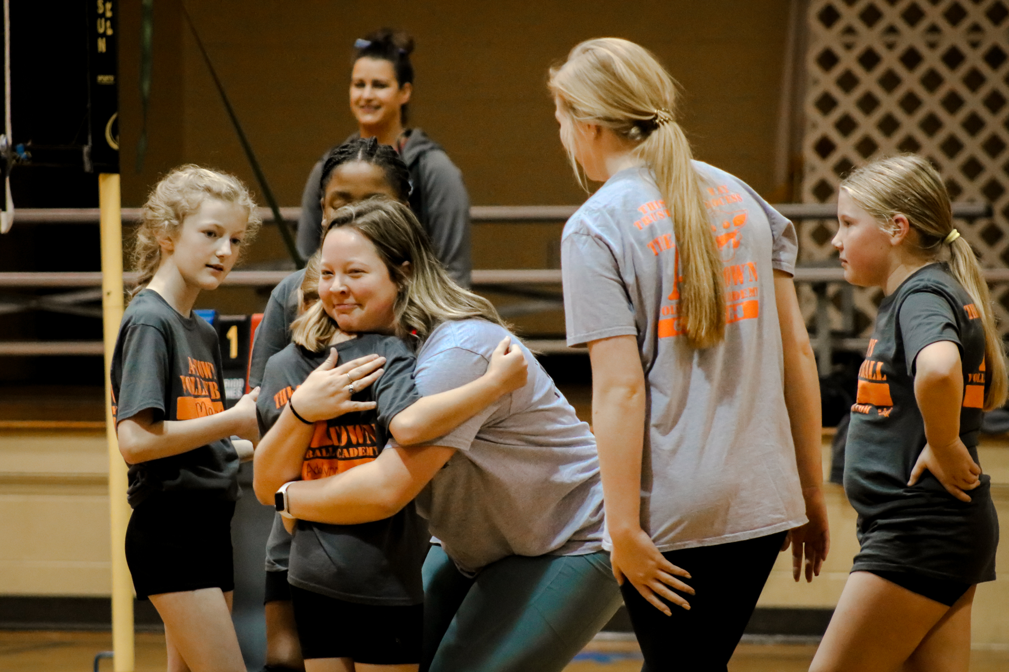 coach hugging a player