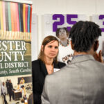 student talking to employer at career fair